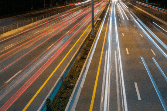 Animated GIF of smooth light trails on a highway at night, symbolizing the dynamic and fluid motion of VerbSuite Classics’ reverb processing.